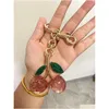 Nyckelringar 2023 Key Bag Accessories Charm Handväska Pendant Handväskor Keychain Womens utsökta Internet-Famous Crystal Cherry Car Drop Del Otyd1