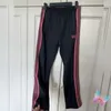 Track Hommes Femmes Broidered Butterfly Needles Sweatles Sweet Sweet Sweet Stripes Street Casual Sports Pants 240420