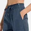 Pantalon féminin Sport des femmes avec Pocket High Taist Fitness Yoga lâche décontracté sécheux plus sèche Pantalon de survêtement Pantalon d'entraînement