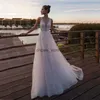 Jasnoróżowa księżniczka plaża liniowa sukienka ślubna bez rękawów V Szybka panny młodej Suknia Tiul Boho Wedding Suknie