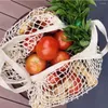 Stume di stoccaggio ecologica in maglia di cotone stringa portatile portatile tote riutilizzabile produzione di borsetta per verdure vegetale.