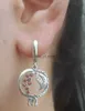 Boucles d'oreilles exquises de lustre en lustre