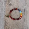 Pulseras de encanto hechas a mano Mujeres vintage originales cuentas de madera Elefante Mala Chakra Bracelet Yoga Healing Seven Strand