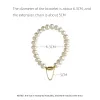 Strängar Elegant White Barock Freshwater Pearls Chain Armband Women Exquisite Advanced Design Personlighet Magnetiska spännsmycken N591