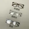 デザイナーサングラスGファミリー眼鏡フレームは、丸い顔とスリミングエフェクトHEFラメックANBを持つ男性と女性の両方のための黒いパネルで作られています