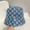 Designer szerokie czapki BRIM HATS HATS NISHE Design Chessboard Checkerboard Fisherman Hat dla mężczyzn Kobiety Mały kapelusz wiadra i zwykły trend twarzy czapek czapek dorzecza