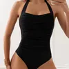 Kvinnors badkläder 2024 Halter Swimsuit Kvinnor En bit solid sexiga svarta kvinnliga badare badar badaddräkt strandkläder