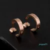 Boucles d'oreilles de couple Gold Hoop Oreing Mode lettre de mode imprimé bijoux Hip Hop Studs Femmes 316L