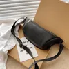 Taillenbeutel Frauenbag 2024 Trend Bananen Schulter rein Farbe Leder Designerin Brustgürtel Weibliche Handtasche Käufer kleiner Geldbörse