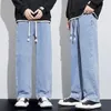 Jeans masculin large jambe pantalon homme baggy ajustement en vrac bleu clair à schéma de traque à schéma fasshion stipes pantalon streetwear