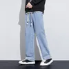 Jeans masculin large jambe pantalon homme baggy ajustement en vrac bleu clair à schéma de traque à schéma fasshion stipes pantalon streetwear