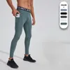 Pantalon masculin arrage serré séchage rapide poches intégrées leggings élastiques à la monnaie de fitness pantalon baggy
