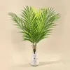 Decoratieve bloemen gesimuleerde planten kunstmatige palmboomdecor voor huizen tuinkantoor plastic nepbladeren