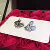 Top Quality Classic Style Fanjia White Beimu Butterfly Earrings 925 Sterling Silver Plated with 18K Gold V Family