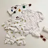 Rompers 2024 Summer New Baby krótkie rękaw Romper Nowonarodzony chłopiec kreskówka Kwiatowy kombinezon bawełna niemowlę cienkie puste piżamę 0-24m H240423