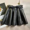 Skirts Girls Leather Skirt Autumn Winter Fashion Baby Girl High Waist Bow PU Mini Black Pleated Princess Tutu H240423