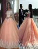 Erröten rosa süße 16 Quinceanera Kleider Ballkleid Batteau Nacken Kurzärärmische Applikationen Tüll Plus Größe Kleider Saudi -Arabisch Prom DR3209834