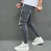 Rippade magra män blyerts jeans byxor stilfulla hiphophoppfläckbläck tryckta hål nödställda stretch denim byxor för mens 240417