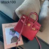 2024 Platinum Autumn/Winter Bag Top Layer Cowhide Women's Bag Wine Red Big Red Litchi Pattern Bag One Shoulder Handbag Handmade äkta läder