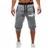 Utländsk handelstrend Men Sports Fifth Pants Drawstring Men Loose Stängande modesportbyxor korta