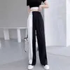 Kvinnors jeans mode trend svart vit fast färg asymmetrisk elastisk midja hög casual full längd byxor raka löst kvinnor kläder y240422
