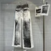 June large de la rue des jeans pour femmes avec motif imprimé abstrait et trou déchiré pour la mode d'été