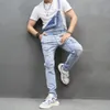 Mężczyźni rozryli szczupły motocykliny dżinsy bibe kombinezony Jumpsy dżinsy stylowe man streetwear elasty