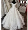 Robe de mariée à manches courtes élégantes avec appliques chérie ouverte arrière tulle