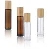 5 ml 10 ml 15 ml Glass Essential Oil Roll på flaskor med rostfritt stål rullbollar och bambu lock påfyllningsbart parfymprov Kosmetisk förpackningsflaska grossist