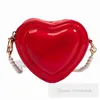 Ins Enfants Love Heart Hands Hands Hands Kids Pearls Chain Single Bag Sac Sac à épaule Filles Patent Circular Messenger Sacs Z7825