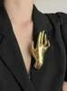 Huanzhi gładki metalowy metalowy kształt dłoni dłoni duża broszka dla kobiet dopasowanie szalika szal biżuteria zimowa twórcza antesories 2024 240423
