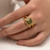 Klein ontwerp overdreven stijl 18k dubbele laag achthoekige olijfgroen zirkoon gebakken deegwendingen ring colorfast sieraden groothandel