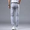 Spring New Light Grey Mens Minimalist Slim Fit Small Feet Fashion Mode European Mand élastique Jean polyvalent