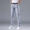 Spring New Light Grey Mens Minimalist Slim Fit Small Feet Fashion Mode European Mand élastique Jean polyvalent