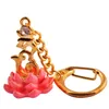 Dekorativa figurer feng shui bejeweled brum på rosa lotus nyckelkedja amulet presentpåse sku: w1026