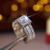 Bandringen super stralende vrouwen mannen mode ring prachtige zilveren kleur ingelegde zirkon stenen bruiloft voor verloving sieraden H240424