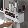 Rack de almacenamiento de soporte de cepillo de dientes magnético Dispensador de pasta de dientes automático Accesorios de almacenamiento de baño impermeables montados en el agua Conjunto de accesorios