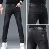 Printemps et automne Nouveau jean gris noir de style droit de mode droite marque élastique slim small small pieds pantalons longs masculins