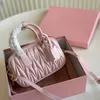 Designer luxury cowhide totes Bag luxurys mesenger bag womens totes Classic pink pleated bowling handbag single shoulder bag crossbody bag size 20*12CM with box