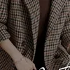 Kvinnors dike rockar qianniao rutnät ullrock för kvinnor 2024 höst och vinter ny kostym krage modeknapp koreansk version ullrock2403