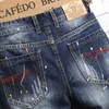 Mode Graffiti Ripped Mens Jean Shorts Patch Raggedy FiveCent Beggar Denim Pants High Quality Brand Jeans Men Clothing 240417