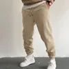 Pantaloni maschile autunno autunno e inverno di alta strada per la moda sport sciolti con pizzo solido in pizzo su maglione carino