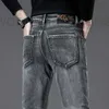 Designer de jeans masculin 2024 jeans bleu printemps slim slim fit small pieds pantalons élastiques coréens gc label 1fl0