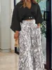 Spring Women Hosen passt zu lässigen zweiteiligen zweiköpfigen Massive V-Ausschnitt-Überschüsse Floral Druck weit loser Hosen Outfits 240412