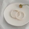 Brin 7 à 8 mm blanc près de rond les perles d'eau douce naturelles bracelet simple femelle élastique fait à la main gift fempère des femmes