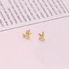 Boucles d'oreilles à quatre points Star pour les femmes asymétriques exquises personnalité mode simple et bijoux en cuivre lisse cadeau
