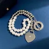 Projektant biżuterii Tiffanyandco Naszyjnik w kształcie serca pojedynczy diament OT Kurek stalowy Naszyjnik Bransoletka z podwójną warstwą perłową okrągłe koraliki