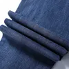 Designer de jeans masculin concepteur de coton de printemps stretch stretch mince jeunesse décontractée pantalon long bleu avec une légère élasticité 9c8h