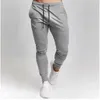 Pantalones para hombres pantalones de chándal a gran tamaño cintura elástica deportes informales pantalones de fitness suelto spring de primavera