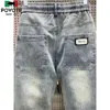 Mäns jeans mode koreanska streetwear lyx varumärke män dragkammare casual lösa denim jeans för våren och hösten stilfulla lastbyxor män 240423